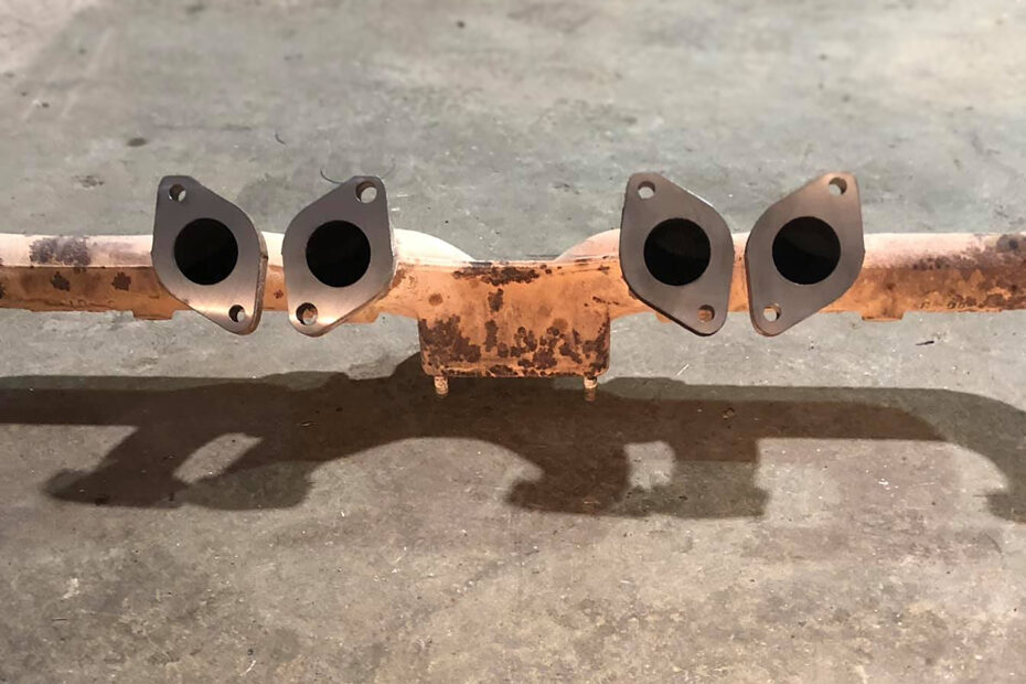 A corroded and old high-flow steel exhaust