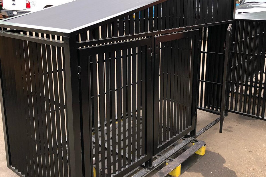 A large steel dog cage on a metal platform