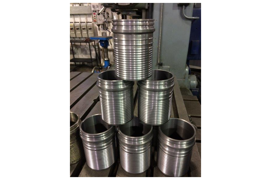 Stainless steel pistons stacked like a pyramid.