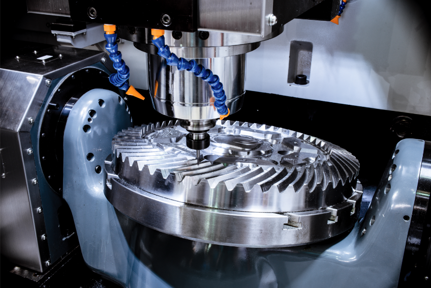 A CNC milling machine works on a large cogwheel